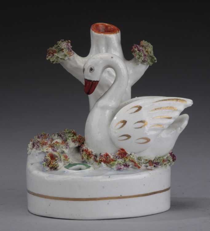 Look for a  Victorian Staffordshire figure of a single swan figure for sale