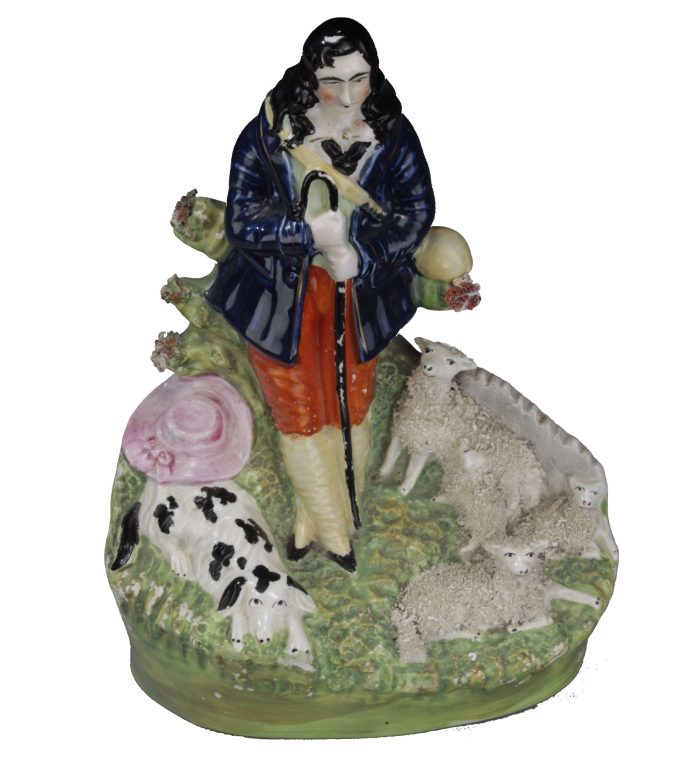 Find a Staffordshire figure of a shepherd, dog, sheep and lambs for sale.