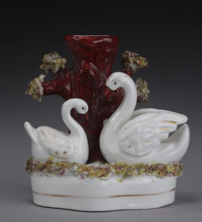 Look for a Victorian Staffordshire figure of a swan spill vase group for sale 