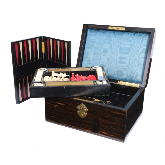 Find an antique games box with chess set and board and other games for sale.