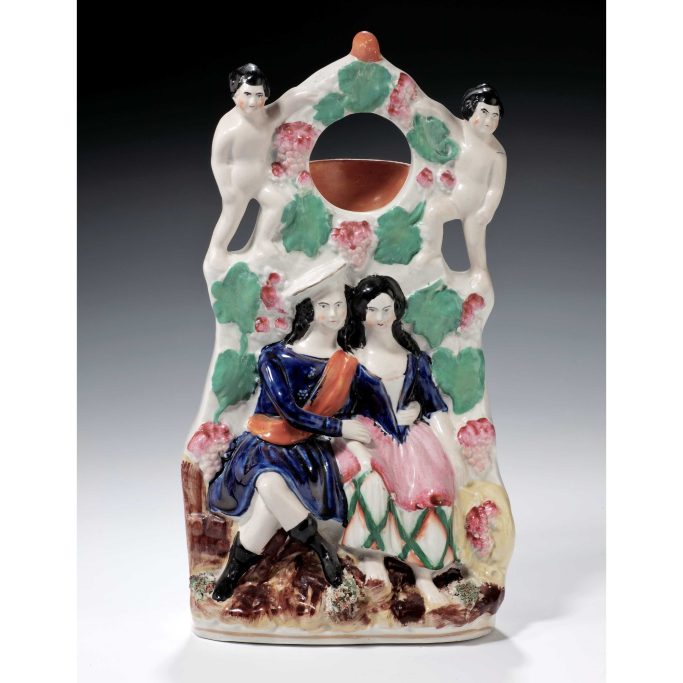Find antique Staffordshire figure of a watch holder with young couple for sale/