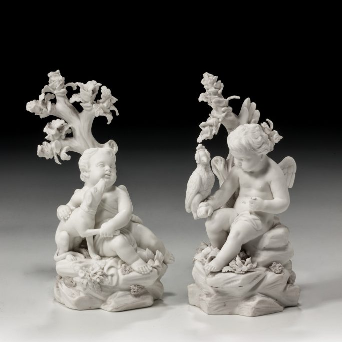 Search for antique pair of Derby biscuit figures of winged cupids for sale
