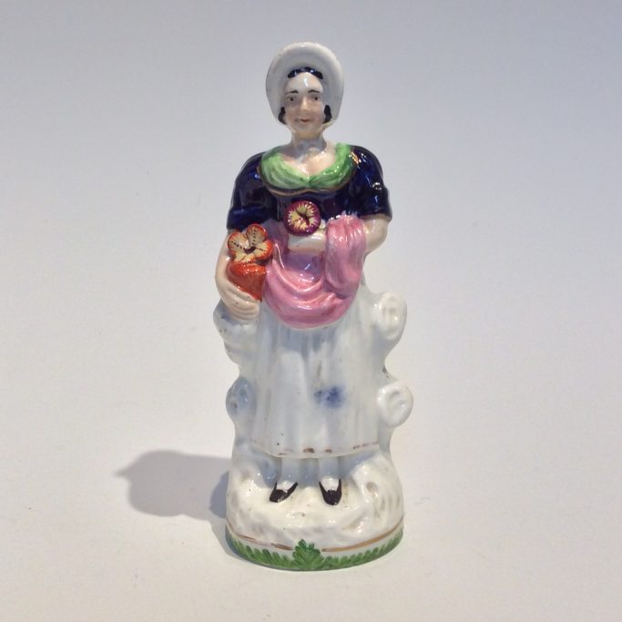 Search for antique Staffordshire decorative figures with flowers for sale.