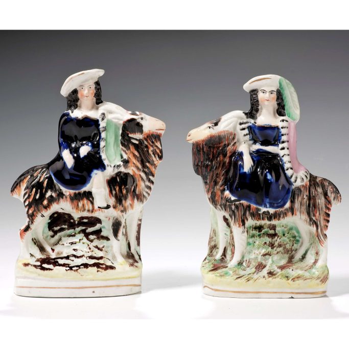 Find antique Staffordshire figures of children sitting on goats for sale.