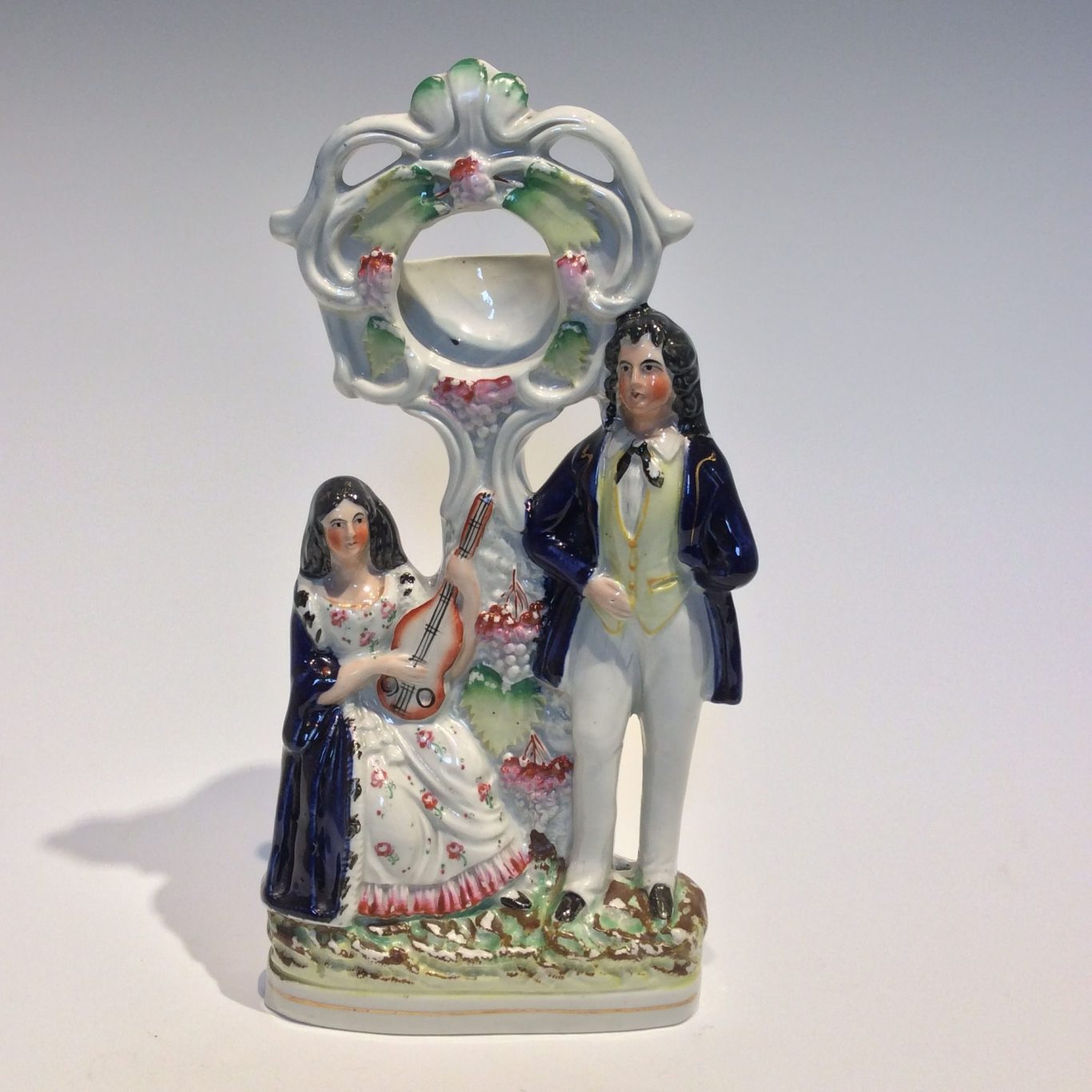 Antique Staffordshire figure of a fob watch holder